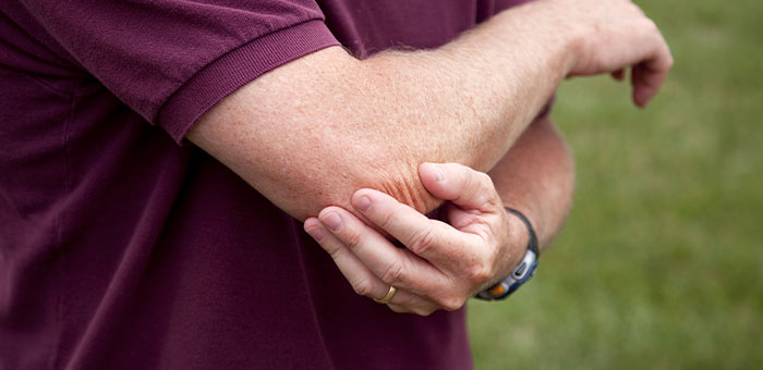 patient needing golfer's elbow treatment in Ontario
