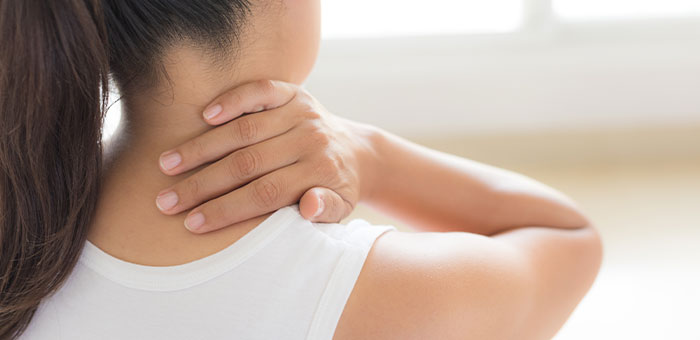 patient needing neck pain treatment in Ontario