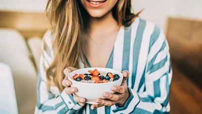 patient eating a healthy cereal after receiving diet guidance from Ontario chiropractor